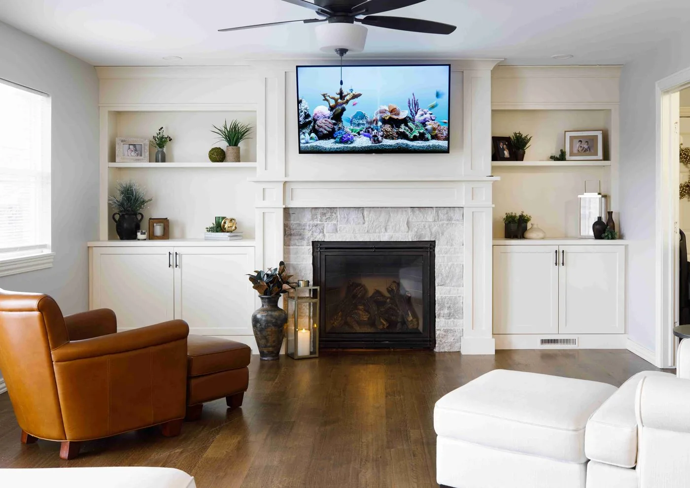 Farmhouse living room with fireplace and built-in shelving