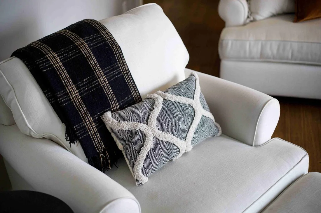 Farmhouse sofa styling detail with textured pillows