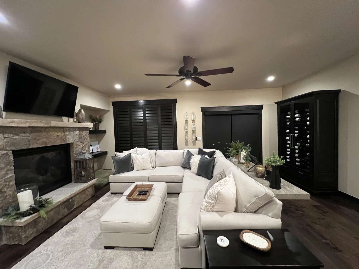 Keystone Escape living room with stone fireplace and sectional seating